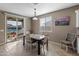 Dining area with outdoor view and access to the patio, perfect for relaxing and enjoying the pool at 1101 W Oleander Ave, Queen Creek, AZ 85140