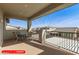 Spacious outdoor balcony with seating area and scenic neighborhood views under a bright sky at 11679 W Parkway Ln, Avondale, AZ 85323