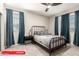 Stylish bedroom with modern furnishings, a ceiling fan and ample natural light at 11679 W Parkway Ln, Avondale, AZ 85323