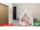 Whimsical bedroom with a tent, soft lighting, and playful decor at 11679 W Parkway Ln, Avondale, AZ 85323