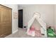 bedroom featuring playful decor and a cozy play area with a tent and soft furnishings at 11679 W Parkway Ln, Avondale, AZ 85323