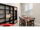 Bright breakfast nook next to a bookshelf for storage and natural light at 11679 W Parkway Ln, Avondale, AZ 85323