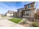 Attractive two-story home with three car garage, xeriscaping, and artificial turf at 11679 W Parkway Ln, Avondale, AZ 85323