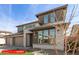 Exterior of two-story home with drought-resistant landscaping, three-car garage, and neutral color palette at 11679 W Parkway Ln, Avondale, AZ 85323