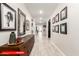 Entryway featuring hardwood floors, a decorative mirror, and contemporary artwork at 11679 W Parkway Ln, Avondale, AZ 85323
