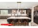 A stunning kitchen with an island, pendant lights, modern appliances, and stylish countertops at 11679 W Parkway Ln, Avondale, AZ 85323