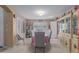 Bright dining room with plantation shutters, stylish chairs, and a charming china cabinet at 12443 W Monte Vista Rd, Avondale, AZ 85323