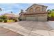 Attractive two-story home with a three-car garage and well-manicured lawn at 12443 W Monte Vista Rd, Avondale, AZ 85323