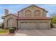 Beautiful two-story home featuring a tile roof and attached three-car garage at 12443 W Monte Vista Rd, Avondale, AZ 85323