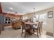 Eat-in kitchen featuring an island with granite countertops and stainless steel appliances at 12443 W Monte Vista Rd, Avondale, AZ 85323