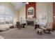 Bright living room with fireplace, and comfortable seating at 12443 W Monte Vista Rd, Avondale, AZ 85323