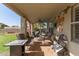 Inviting covered patio area perfect for outdoor dining and relaxation with comfortable seating at 12443 W Monte Vista Rd, Avondale, AZ 85323