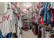 Spacious walk-in closet with rows of shelving and hanging racks for optimal storage at 12443 W Monte Vista Rd, Avondale, AZ 85323