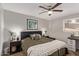 Serene main bedroom with warm tones, cozy throw blanket, and natural light at 1310 S Pima St # 34, Mesa, AZ 85210