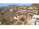 Aerial view of a home with solar panels and a beautiful view of the surrounding desert landscape at 1428 E Las Palmaritas Dr, Phoenix, AZ 85020