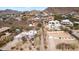 Aerial view of the community with a home in the foreground and mountain views at 1428 E Las Palmaritas Dr, Phoenix, AZ 85020