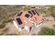 Aerial view of a two-story home with a red tile roof and solar panels at 1428 E Las Palmaritas Dr, Phoenix, AZ 85020