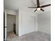 Bedroom featuring tile flooring, a ceiling fan, and a sliding door closet at 1428 E Las Palmaritas Dr, Phoenix, AZ 85020