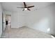 Bedroom with tile floor, sliding door closet and a ceiling fan at 1428 E Las Palmaritas Dr, Phoenix, AZ 85020