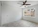 Bright bedroom with neutral walls, tile floor, and desert views at 1428 E Las Palmaritas Dr, Phoenix, AZ 85020