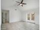 Unfurnished bedroom with balcony access, tile floor, and bright lighting at 1428 E Las Palmaritas Dr, Phoenix, AZ 85020