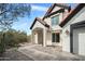 Home exterior featuring tile roof, front walk with desert landscaping, and an inviting covered entry at 1428 E Las Palmaritas Dr, Phoenix, AZ 85020