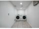 Bright laundry room equipped with a white, front-load washer and dryer at 1428 E Las Palmaritas Dr, Phoenix, AZ 85020