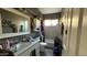 This home's gray bathroom features a marble vanity, framed mirror, and a shower-tub combination with tile surround at 14440 N 56Th Pl, Scottsdale, AZ 85254