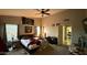 Spacious bedroom featuring a ceiling fan, a window, and decor at 14440 N 56Th Pl, Scottsdale, AZ 85254