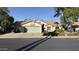 Charming single-story home featuring a well-maintained lawn and a two-car garage at 14440 N 56Th Pl, Scottsdale, AZ 85254