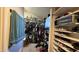 Walk-in closet with shelving, racks, and decor at 14440 N 56Th Pl, Scottsdale, AZ 85254