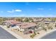 Aerial view highlights the house's exterior, landscaping, and rooftop solar panels in the community at 14612 W Edgemont Ave, Goodyear, AZ 85395