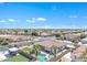 Expansive aerial view showcases the backyard oasis, including a pool, turf area and outdoor kitchen at 14612 W Edgemont Ave, Goodyear, AZ 85395