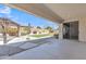 Backyard with artificial turf, rock landscaping, pergola, covered patio, and desert plants at 14612 W Edgemont Ave, Goodyear, AZ 85395