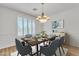 Dining room features a modern chandelier and a window bringing lots of natural light at 14612 W Edgemont Ave, Goodyear, AZ 85395