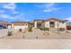 Well-maintained home featuring desert landscaping, a tile roof, and a welcoming front entrance at 14612 W Edgemont Ave, Goodyear, AZ 85395