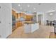 Bright kitchen featuring stainless steel appliances, center island, and tile flooring at 14612 W Edgemont Ave, Goodyear, AZ 85395