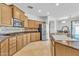 Spacious kitchen featuring stainless steel appliances, an island, and a breakfast bar at 14612 W Edgemont Ave, Goodyear, AZ 85395