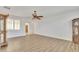 Spacious living room with wood floors, ceiling fan and lots of natural light at 14612 W Edgemont Ave, Goodyear, AZ 85395