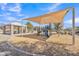 Neighborhood playground offers shade coverings, play equipment, and is mulched with wood chips at 14612 W Edgemont Ave, Goodyear, AZ 85395