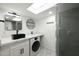 Updated bathroom with new shower, vanity, and a laundry machine for added convenience at 1509 W Kiowa Ave, Mesa, AZ 85202