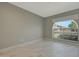 Cozy bedroom features an arched window, neutral tones, and great natural light at 1509 W Kiowa Ave, Mesa, AZ 85202