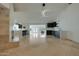 Bright living room featuring a modern fireplace, a wet bar area, and seamless access to the kitchen at 1509 W Kiowa Ave, Mesa, AZ 85202