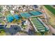 Aerial view of community tennis and pickleball courts showcasing well-maintained recreational facilities at 15479 W Whitton Ave, Goodyear, AZ 85395