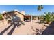 Spacious backyard featuring a covered patio and xeriscaping for a low-maintenance desert oasis at 15479 W Whitton Ave, Goodyear, AZ 85395