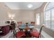 Cozy dining area with decorative rug, lots of light and seating for four at 15479 W Whitton Ave, Goodyear, AZ 85395