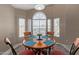 Cozy dining area with decorative rug, lots of light and seating for four at 15479 W Whitton Ave, Goodyear, AZ 85395