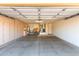 Spacious garage with built-in cabinets for ample storage and room for two cars at 15479 W Whitton Ave, Goodyear, AZ 85395