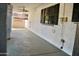 Relaxing covered back porch with neutral tones and a ceiling fan is perfect for outdoor enjoyment at 16029 N 36Th Dr, Phoenix, AZ 85053