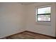 Bright bedroom featuring a window and modern wood-look floors at 16029 N 36Th Dr, Phoenix, AZ 85053